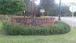 Welcome Sign at the entrance to Woodbranch Village