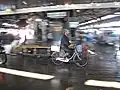 Motion blur is evident in this photo of a worker at the former Tsukiji fish market in Tokyo