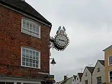 The Tolsey clock commemorates the Diamond Jubilee (60 years) of Queen Victoria's reign. The clock says "1837 – 1897". It lies between Market Street and High Street.