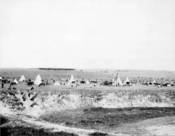 Reenactment of U.S. troops surrounding the Lakota at Wounded Knee (1913).