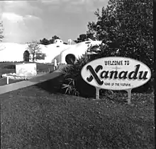 A photo of a welcome sign and entry path for the Xanadu house in Kissimmee, Florida.