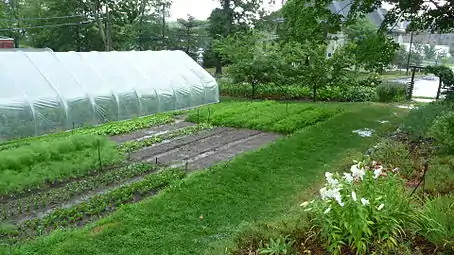 Spring Storm at the Yale Farm showing covered hoophouse