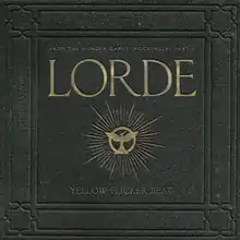 Cover art features a hard-cover print with the song and title printed in dull, gold colors. An image of a Mockingjay is portrayed in the center.