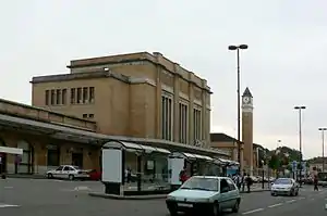 Boxy four-story brick building