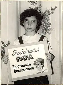 Sánchez in 1982 holding a sign.