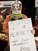 Yuri's Night 2010 celebration at the Goddard Space Flight Center, the sign on the astronaut reads "Pluto is a planet, not just Mickey's dog"