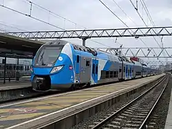 Regio 2N (train unit Z 55521/22), in TER Auvergne-Rhône-Alpes branding at Lyon-Part-Dieu station.