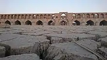 The dry Zayanderud river with Si-o-se-pol in the background