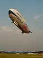 An airship class aircraft in the aerostat category, a Zeppelin NT