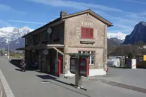 Stone two-story building with gabled roof