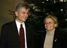 Smiling man and woman standing together