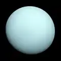 The planet Uranus, seen from the Voyager 2 spacecraft. The cyan color comes from clouds of methane gas in the planet's atmosphere.