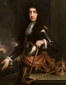 Oil portrait of Charles with heavy jowls, a wig of long black curls and in a suit of armour.