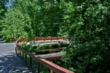 A road bridge spanning over a stream