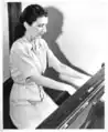 Violet Archer at the piano. Source: University of Alberta Archives