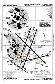 A map with a grid overlay showing the terminals runways and other structures of the airport.