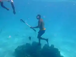 Two spear fishermen from the pirogue.