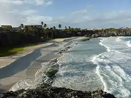 By January 2014 sand movement had again exposed the troublesome rocks in Cave Bay.