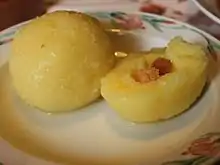 Potato dumplings filled with toasted white bread dices