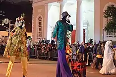 Children in costumes walking in the street