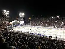 A football stadium with a hockey rink in the center