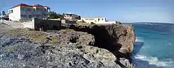 Olivers Cave, Ocean City, St Philip Barbados is a natural landmark from The Fathom Reef, Cobblers Reef Barbados. It is difficult to visualise the cave from the Cliff top. The house is precariously perched on top of the undercut rocks. Locals do not how long it will survive.