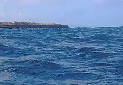 Kitridge Point from northern portion of Cobblers Reef with East Point Lighthouse in the background.