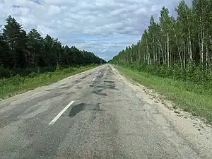 Latvian regional road P86 in 2020, uneven and over-patched