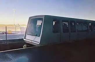 A futuristic looking automatic people mover in front of Stansted airfield