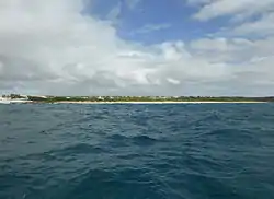 Long beach is usually empty apart from Kite surfers. Two can just be seen to the right.