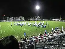 A huge light pointed toward a football field