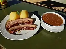 Smoked meat with beans and potato dumplings