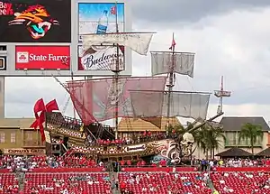 A large pirate ship behind the seats in the stadium