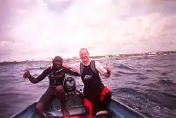 Roger C. and pirogue owner "Tiny" after diving on Cobblers Reef.