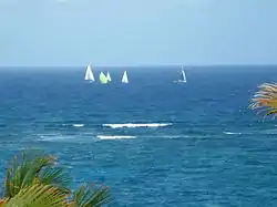 The yachts pass 3 km off shore well clear of the Fathom in the Round Barbados race 2013.