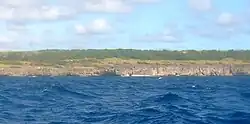 This little beach is about a kilometre north east of the previous  beach. A practicable exit for a stranded diver. Note the rock at the left.