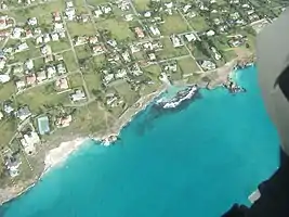 Small beach south of Sharks Hole from a microlight. When the tide or surf is high the surf may pound on the low rocks.