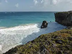 The rock on the left (viewed from the sea) can be seen on the right from the land.