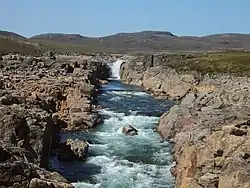 A river running in rocky land