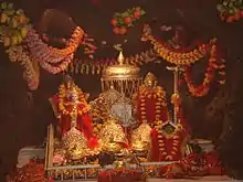 The three icons representing the three aspects of the Mother Goddess in the Vaishno Devi temple shrine.