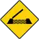 A diamond-shaped with yellow background and black border, with a symbol of an open draw bridge